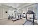 Fitness center equipped with treadmills and elliptical machines, plus mirrored wall at 724 Terrace Ridge Cir # 724, Davenport, FL 33896