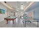 Entertaining game room complete with a pool table and a ping pong table at 724 Terrace Ridge Cir # 724, Davenport, FL 33896