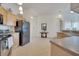 Spacious kitchen features ample counter space and is open to the living areas at 724 Terrace Ridge Cir # 724, Davenport, FL 33896