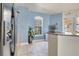 The kitchenette features tile floors, natural light, and modern stainless steel appliances at 724 Terrace Ridge Cir # 724, Davenport, FL 33896