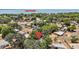Aerial view showcases the property's location near Lake Eustis, surrounded by lush greenery and residential streets at 819 Edgewater Dr, Eustis, FL 32726