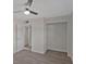 Bedroom with hardwood flooring, a ceiling fan, and a large closet at 819 Edgewater Dr, Eustis, FL 32726