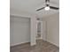 Bedroom with hardwood flooring, a ceiling fan, and a closet at 819 Edgewater Dr, Eustis, FL 32726