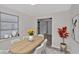 Bright dining room with an oval table, white chairs, and hardwood floors at 819 Edgewater Dr, Eustis, FL 32726