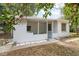 Exterior shot of home showcasing the covered patio at 819 Edgewater Dr, Eustis, FL 32726