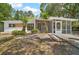 Charming single-story home featuring a screened porch and partially landscaped front yard at 819 Edgewater Dr, Eustis, FL 32726
