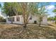 Exterior shot of a home with a covered patio at 819 Edgewater Dr, Eustis, FL 32726
