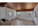 Empty living room with wood ceiling, tile floor, and ample natural light at 819 Edgewater Dr, Eustis, FL 32726