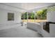 A covered patio, featuring a built in counter with a grill at 819 Edgewater Dr, Eustis, FL 32726