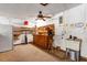 Basement with work area that includes an antique wash basin, ceiling fan, tool storage, and many shelves for organization at 1039 Whispering Cv, Casselberry, FL 32707
