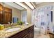 Bathroom featuring a granite countertop vanity and floral shower curtain at 1039 Whispering Cv, Casselberry, FL 32707