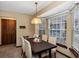 A bright breakfast nook features a bay window with a view of the backyard at 1039 Whispering Cv, Casselberry, FL 32707