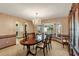 Classic dining room with bay window and ornamental wallpaper detailing at 1039 Whispering Cv, Casselberry, FL 32707