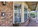The charming brick exterior features lovely bay windows and a brick porch at 1039 Whispering Cv, Casselberry, FL 32707