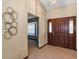 Welcoming foyer with tile flooring, decorative wall art, and view to living room at 1039 Whispering Cv, Casselberry, FL 32707