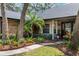 Charming home with brick exterior, lush landscaping, and covered entryway at 1039 Whispering Cv, Casselberry, FL 32707