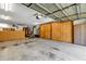 Spacious garage with high ceilings, pegboard storage, and utility hookups offers ample space for projects and parking at 1039 Whispering Cv, Casselberry, FL 32707