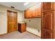 Functional laundry room featuring a sink, cabinets, and convenient access to utilities and storage at 1039 Whispering Cv, Casselberry, FL 32707