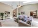 Open-concept living room with a brick fireplace, wood accents, and comfortable seating at 1039 Whispering Cv, Casselberry, FL 32707