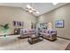 Bright living room with skylights, neutral colors, and comfortable sofas at 1039 Whispering Cv, Casselberry, FL 32707