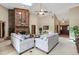 Bright living room featuring a brick fireplace, skylights, and comfortable seating at 1039 Whispering Cv, Casselberry, FL 32707
