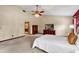 Spacious main bedroom with vaulted ceiling, carpet, and view into bathroom at 1039 Whispering Cv, Casselberry, FL 32707