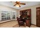 Inviting home office with a bay window and built-in desk at 1039 Whispering Cv, Casselberry, FL 32707