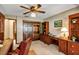 Home office featuring dark wood furnishings and a large bay window at 1039 Whispering Cv, Casselberry, FL 32707
