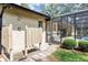 This backyard features an outdoor shower right outside the screened in lanai and pool area at 1039 Whispering Cv, Casselberry, FL 32707