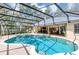 This stunning pool is fully screened in and has a spacious patio and manicured landscaping at 1039 Whispering Cv, Casselberry, FL 32707