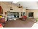 Sunroom features tiled floors, multiple ceiling fans, and direct views of the pool at 1039 Whispering Cv, Casselberry, FL 32707