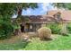 Green backyard with a covered patio and a landscaped yard for outdoor enjoyment at 1107 Monroe Ave, St Cloud, FL 34769