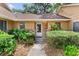 Inviting front entrance with brick accents and well-maintained landscaping at 1107 Monroe Ave, St Cloud, FL 34769