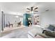 Open-concept living room and dining area with neutral colors and modern accents at 1107 Monroe Ave, St Cloud, FL 34769
