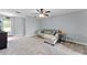 Comfortable living area with carpet, ceiling fan, and neutral paint at 1107 Monroe Ave, St Cloud, FL 34769