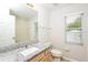 A well-lit bathroom featuring granite counters and a shower-tub combo at 111 Spring Ridge Dr, Debary, FL 32713