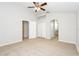 Primary bedroom with neutral walls, large closets, and access to an ensuite bathroom at 111 Spring Ridge Dr, Debary, FL 32713