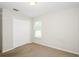 This bedroom offers neutral carpet, window with blinds, and standard closet at 111 Spring Ridge Dr, Debary, FL 32713