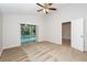 Spacious bedroom boasts slider to pool and spa, neutral walls, carpet and a ceiling fan at 111 Spring Ridge Dr, Debary, FL 32713