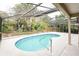 Enjoy swimming in this screened-in pool surrounded by tropical landscaping at 111 Spring Ridge Dr, Debary, FL 32713