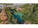 Aerial view showing community tennis courts near landscaped entrances and a convenient parking area at 1111 Salerno Ct # Ge, Orlando, FL 32806