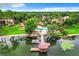 Stunning aerial view of lakefront condos, community pool, lush landscaping, and boat dock at 1111 Salerno Ct # Ge, Orlando, FL 32806