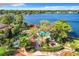 Stunning aerial view showcasing pool and lakefront amenities with lush greenery at 1111 Salerno Ct # Ge, Orlando, FL 32806