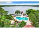 Aerial view showing pool, boat dock, and lake, beautiful landscaping and amenities for residents to enjoy at 1111 Salerno Ct # Ge, Orlando, FL 32806