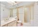 Cozy bathroom featuring a shower with glass enclosure, vanity with ample storage, and a clean, classic design at 1111 Salerno Ct # Ge, Orlando, FL 32806