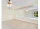 Spacious bedroom with a ceiling fan, closet, and large mirror providing a functional and comfortable living space at 1111 Salerno Ct # Ge, Orlando, FL 32806
