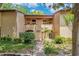 Inviting two-story condo with lush landscaping and a well-maintained walkway at 1111 Salerno Ct # Ge, Orlando, FL 32806