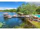 Beautiful water view showing the pool, jacuzzi, gazebo and mature landscaping at 1111 Salerno Ct # Ge, Orlando, FL 32806