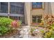Private outdoor patio with screened-in porch, surrounded by mature landscaping at 1111 Salerno Ct # Ge, Orlando, FL 32806