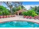 Inviting pool area with lounge chairs and shaded cabana for relaxation at 1111 Salerno Ct # Ge, Orlando, FL 32806